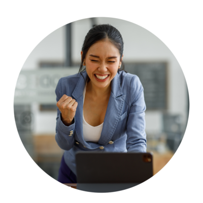 f-asia-fist-pump HR employee excited while using laptop