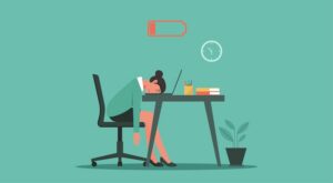 cultural atrophy blog feature image - a woman at her desk with a low battery symbol above her